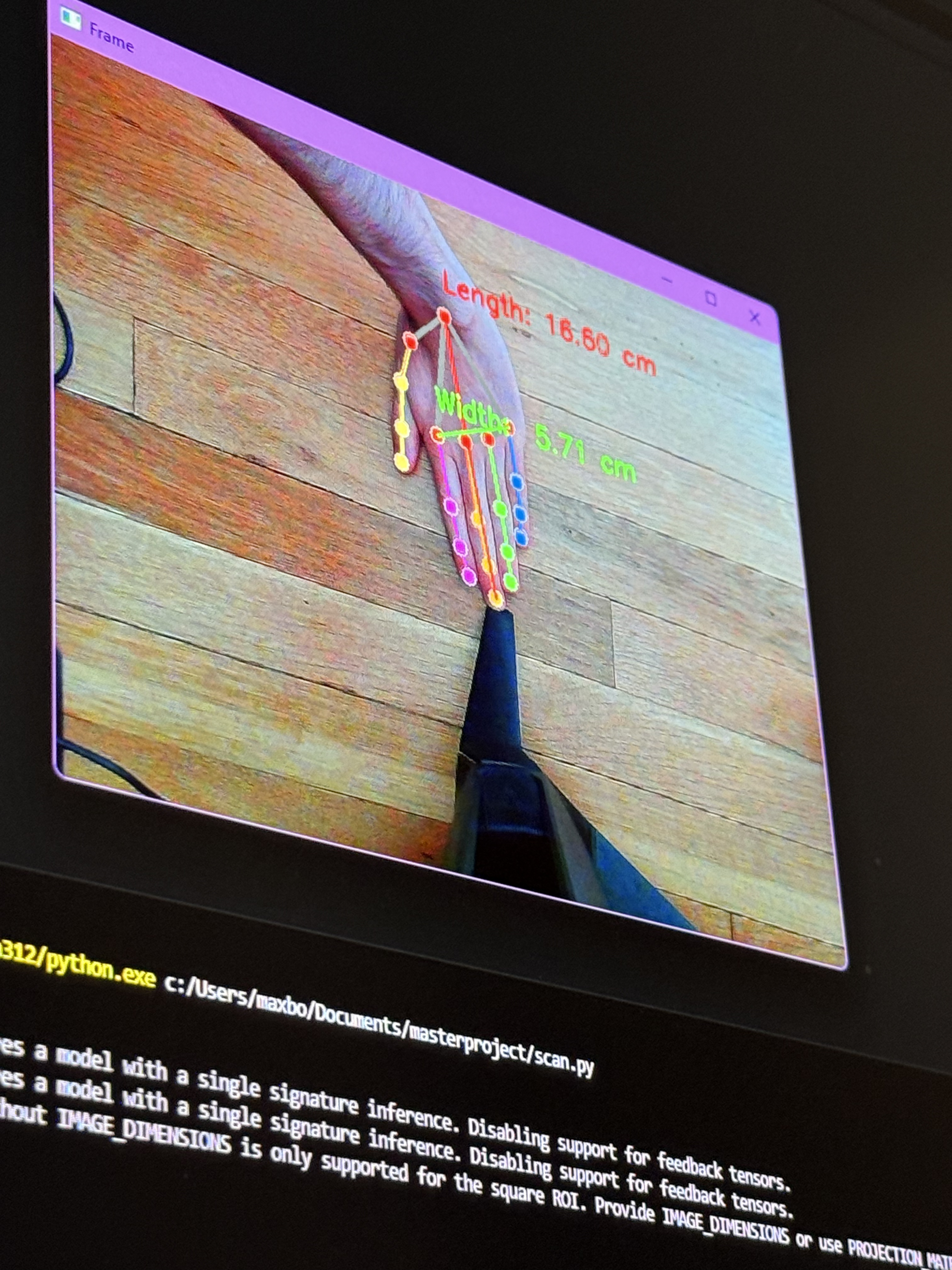 MediaPipe hand scan showing length and width measurements